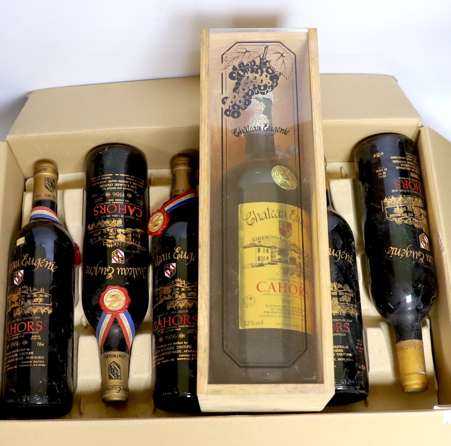 Twelve bottles of Chateau Eugenie, Cahors wine: four bottles 1986, three bottles 1990, three bottles 1986 and one bottle 1987 plus a boxed 1987 magnum (12)
